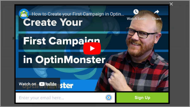 Lightbox popup with an embedded YouTube video. There is a field to enter an email address and a "Sign Up" call-to-action button.
