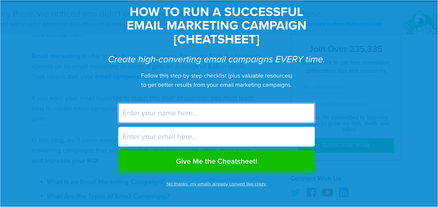 OptinMonster fullscreen website popup that says "How to Run a Successful Email Marketing Campaign [Cheatsheet] Create high-converting email campaigns EVERY time." Fields ask for name and email address. CTA button reads "Give Me the Cheatsheet!"