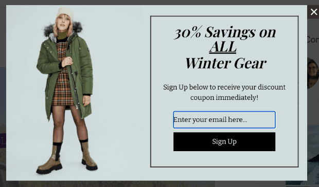 Popup that says "30% Savings on ALL Winter Gear" with a photo of a woman in a heavy coat, hat, and boots.
