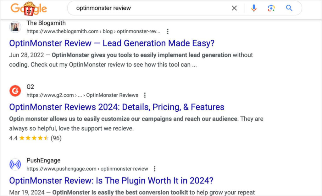 A Google search for "optinmonster review." Search results include reviews fro The Blogsmith, PushEngage, and OptinMonster's G2 page.