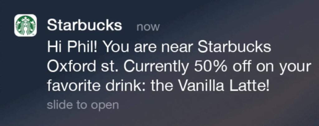 Geofencing mobile marketing example from Starbucks. It's a push notification that says "You are near Starbucks Oxford st. Currently 50% off on your favorite drink: the Vanilla Latte!"